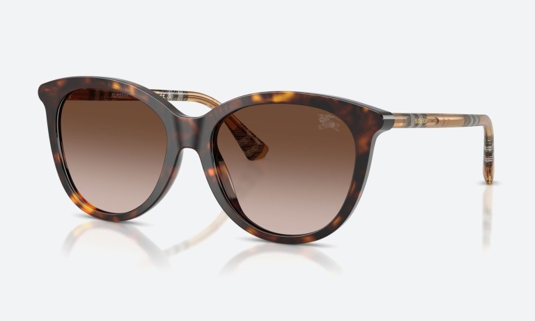 Hero flat-lay of luxury sunglasses for women on a neutral background