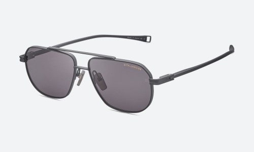 Prescription sunglasses with a gradient tinted lens on a neutral background