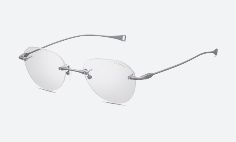 Lifestyle shot of rimless eyewear being tried on, how to choose rimless glasses