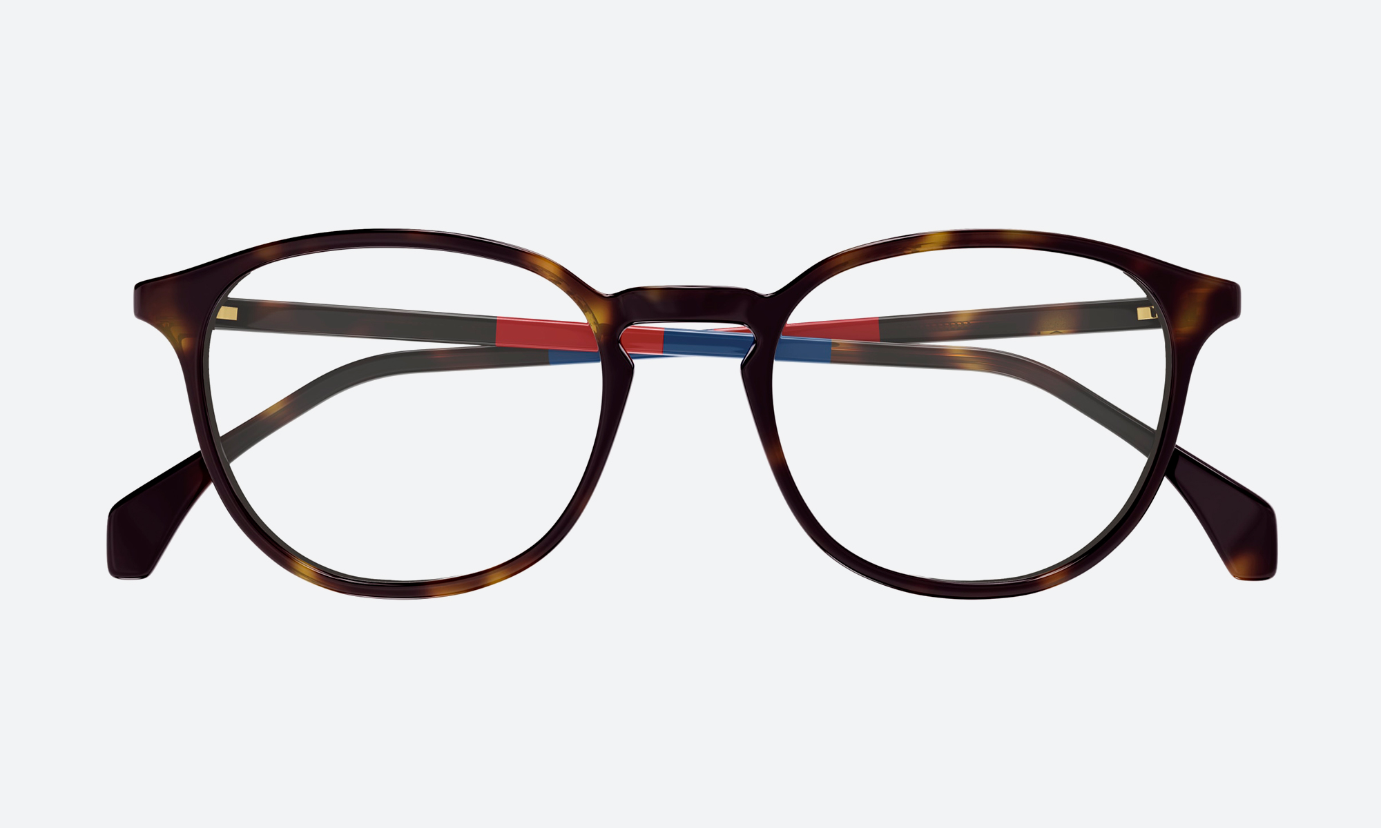 Woman wearing tortoiseshell cat eye sunglasses for women with gradient brown lenses