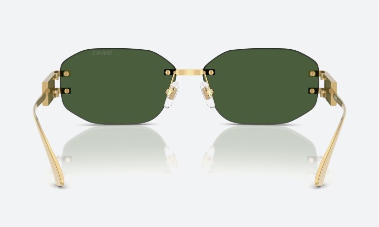 Flat-lay of Versace glasses frames with the Medusa detail