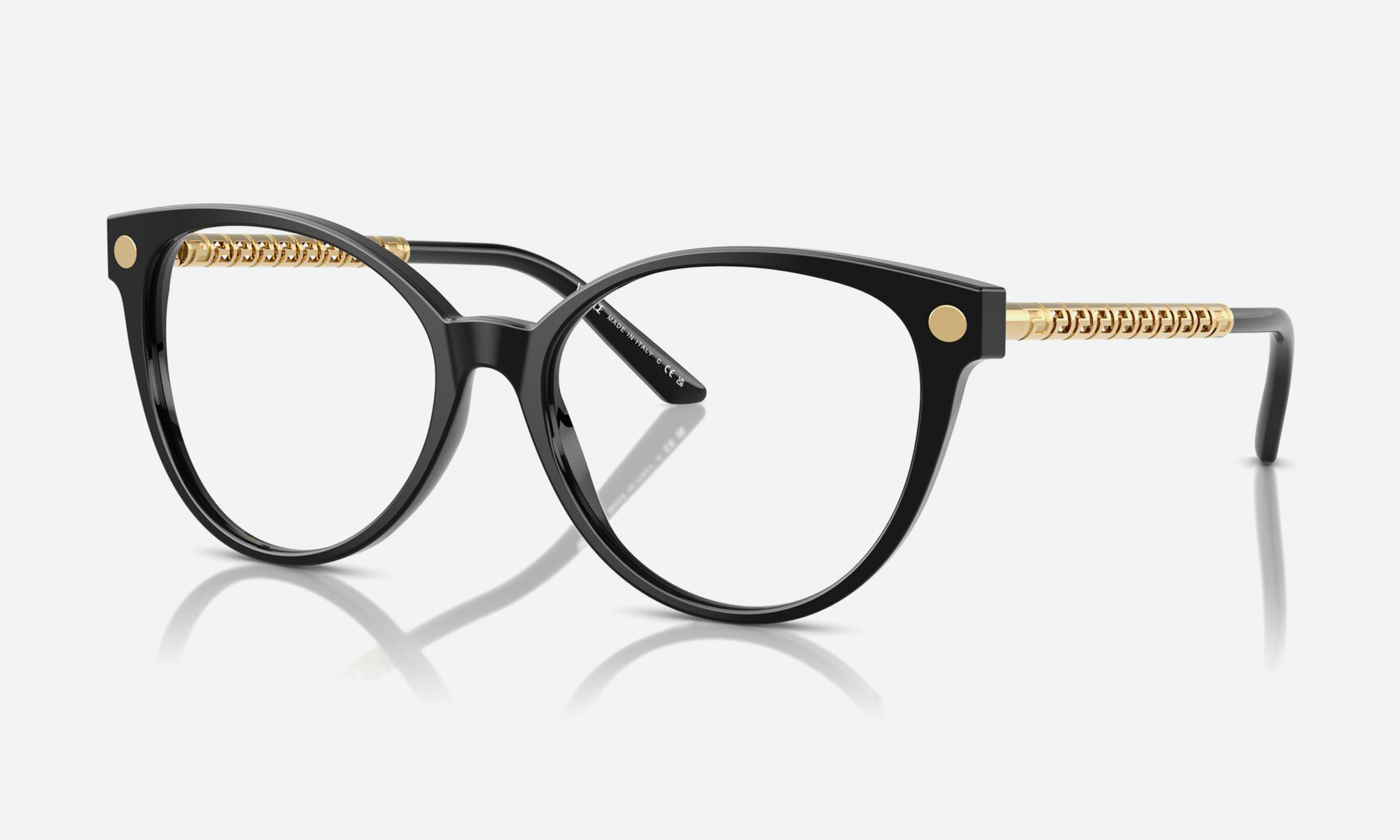Cat eye sunglasses arranged flat on a neutral background showing upswept acetate frames
