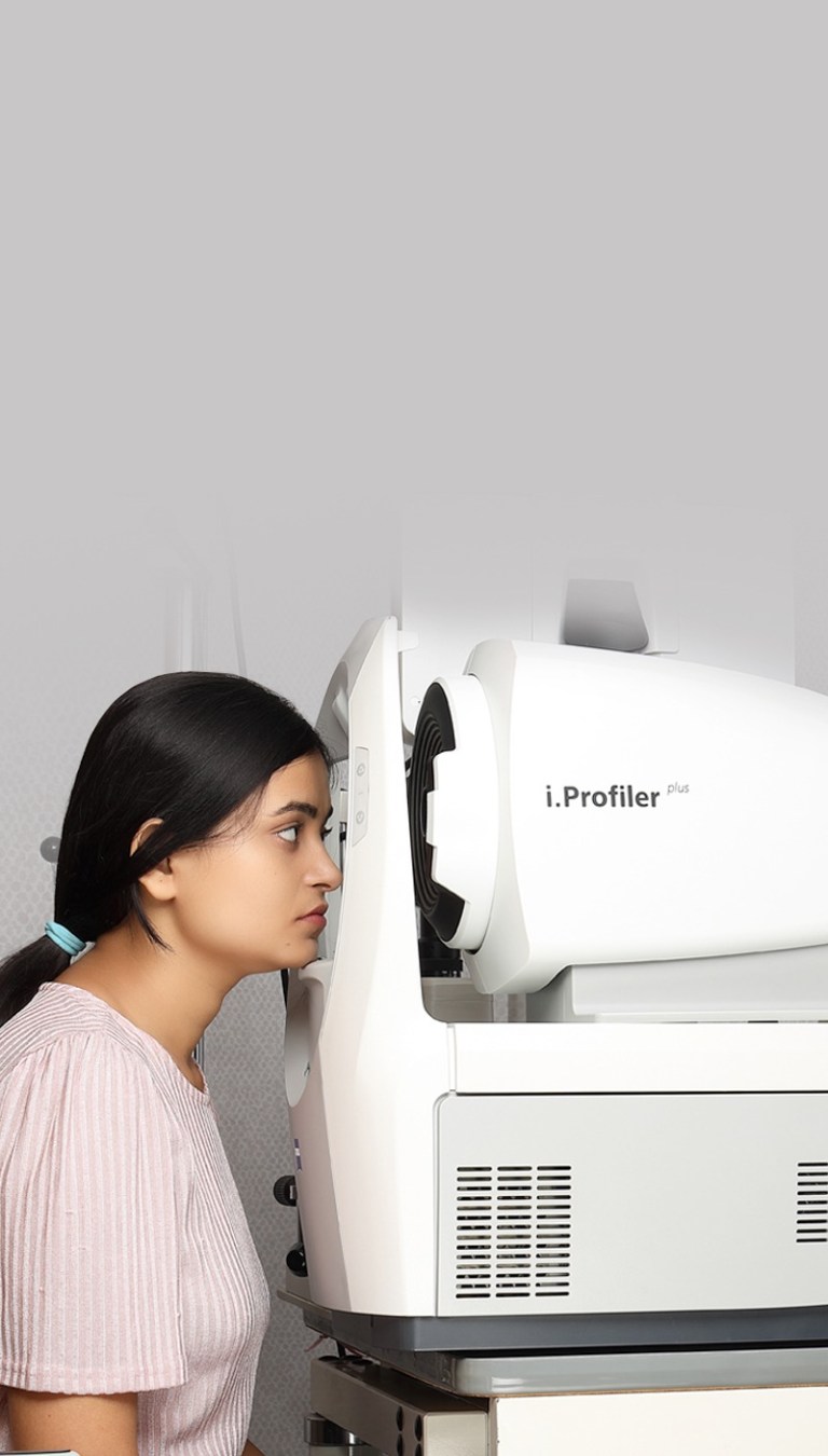 Optometrist explaining eye test results to a client | Refraction check in progress at the Boutique