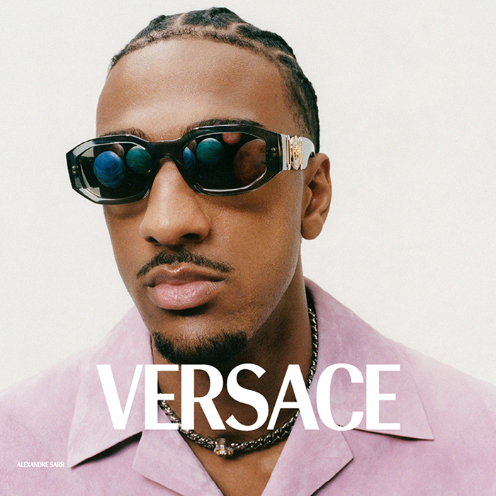 Man wearing Versace sunglasses for men, rectangular acetate with Greca temple detail