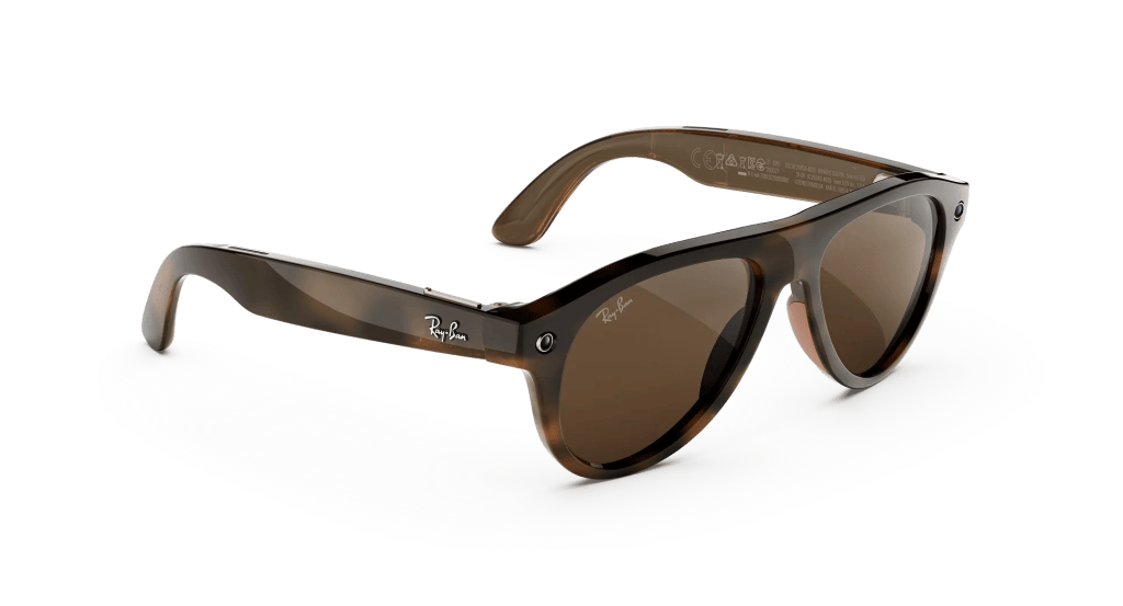 Professional wearing Ray-Ban Meta Gen 3 smart glasses at an office desk